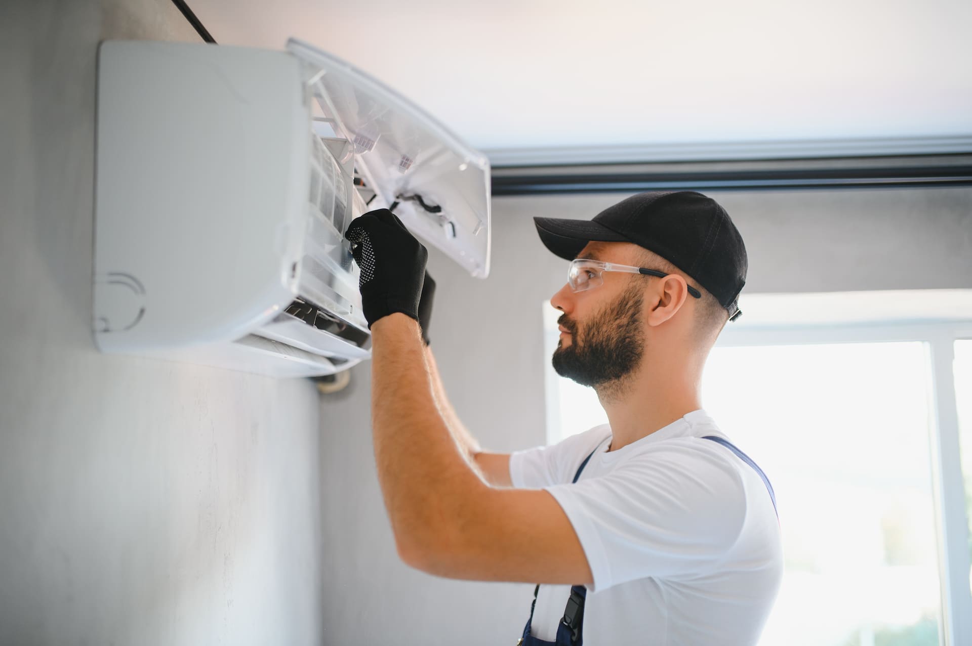 Technician Performs Air Conditioning Maintenance Diagnostics