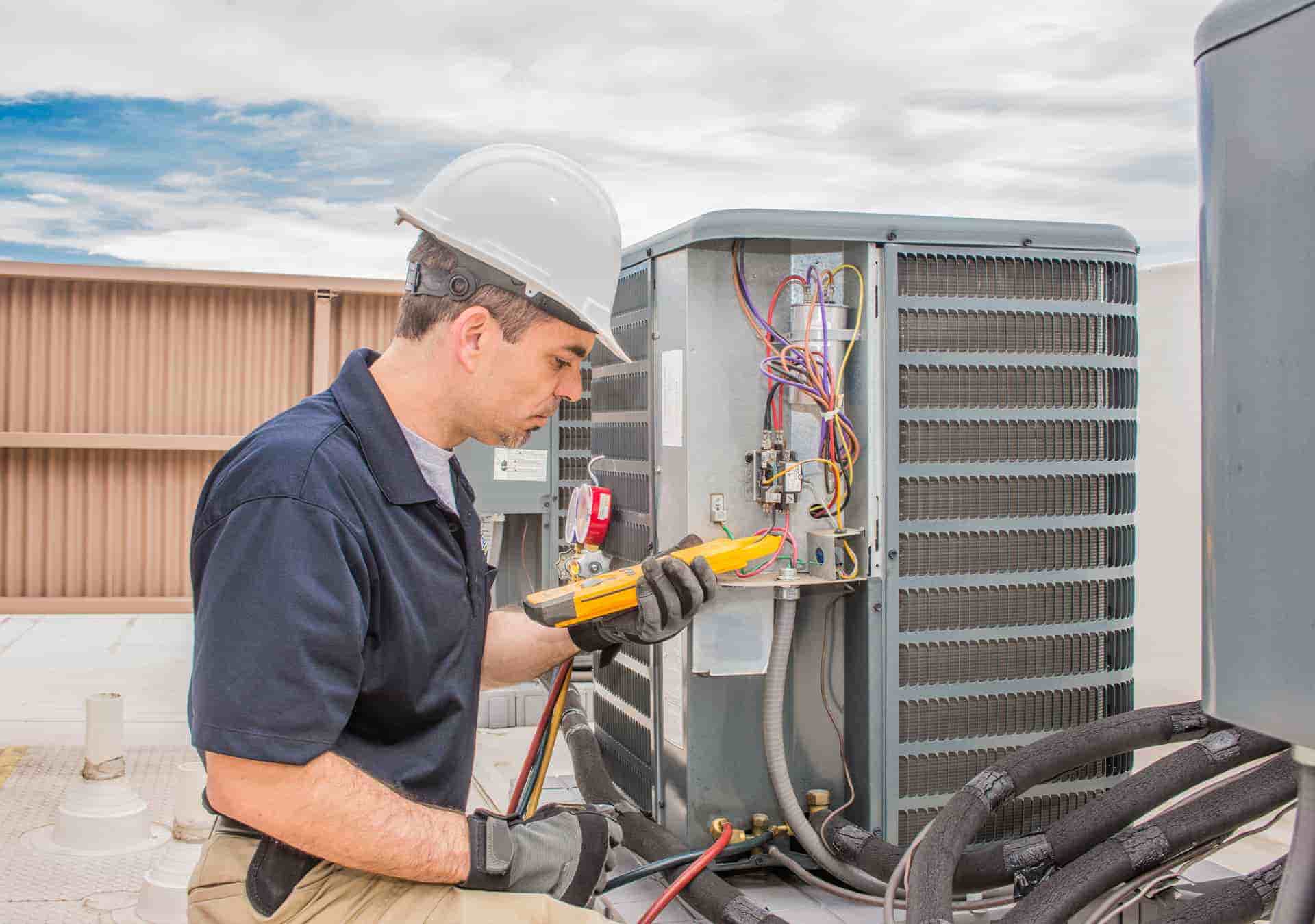 Technician Performs Air Conditioning Maintenance Diagnostics